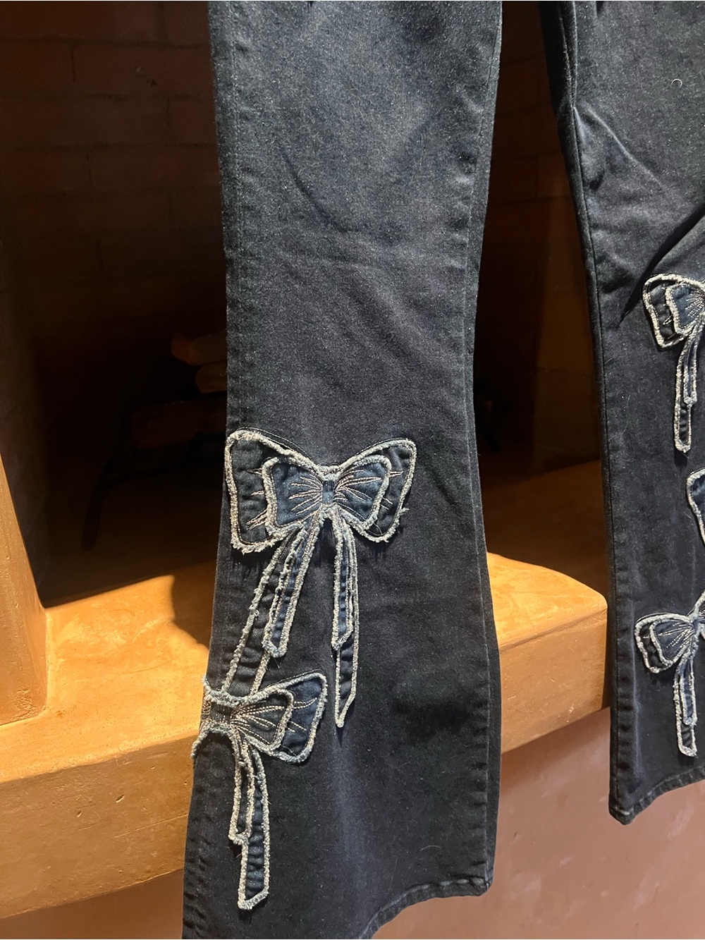 DRIFTWOOD Navy Washed Denim Jeans with bows accent - Picture 3 of 6
